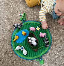 Load image into Gallery viewer, Young child playing with a fabric farm set