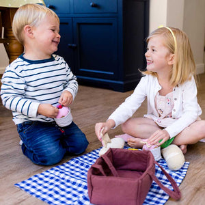 Children playing with fabric picnic play set