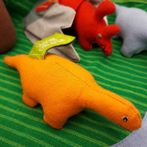 A small orange toy dinosaur