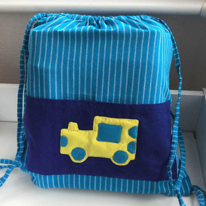 Turquoise fabric gym bag with train on pocket