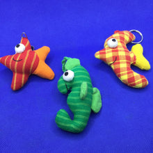 Load image into Gallery viewer, Colourful fish-shaped key rings made from patterned fabric
